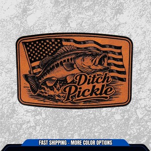 May include: An orange rectangular patch with a black illustration of a fish jumping out of water, with an American flag in the background. The text "Ditch Pickle" is below the fish.
