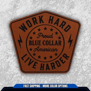 May include: A brown leather patch with the text "WORK HARD LIVE HARDER". The patch has a pentagon shape with a circular design in the center that reads "Proud Blue Collar American" with stars. Lightning bolt graphics are on each side.