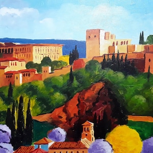 May include: A painting of a Spanish castle with red tile roofs and white walls, surrounded by lush green trees and bushes. The castle is set against a backdrop of blue mountains and a bright blue sky with white clouds.