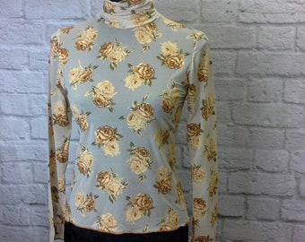Transparent jersey turtleneck Sweater with ochre printed roses, elegant floral sweater with high collar and long sleeves in elastic jersey.