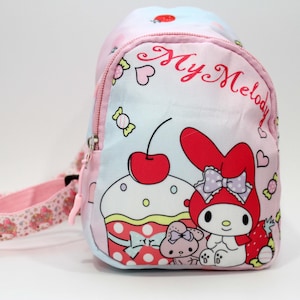 raines backpack Rains Trail Clip Front | Backpack | Green Crafted from 100% polyester Retired Sanrio Hello Kitty metal details:Brass Convertible Classic