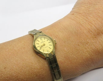 Montre HELVA Suisse Mécanique Femme - Boîtier Or, Cadran Doré, Bracelet Cuir Noir, Occasion
