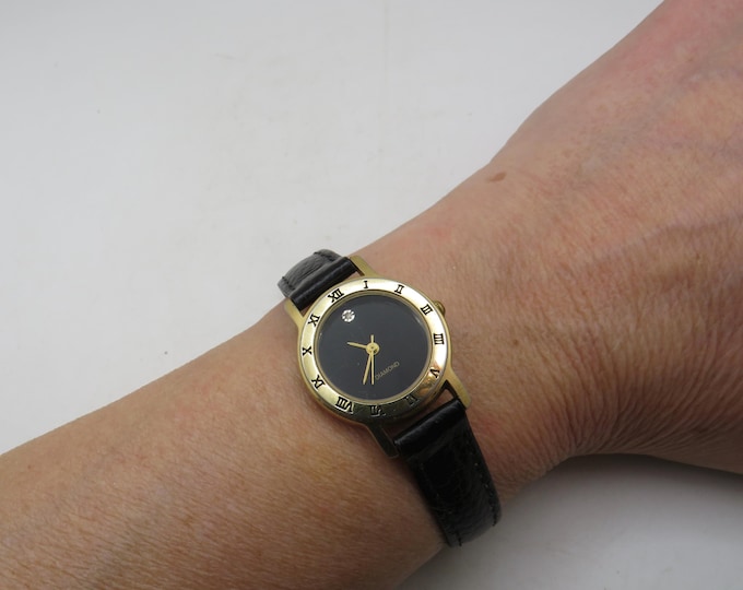 Vintage diamond watch, Gold plate Finish, black dial Leather Strap (p23)