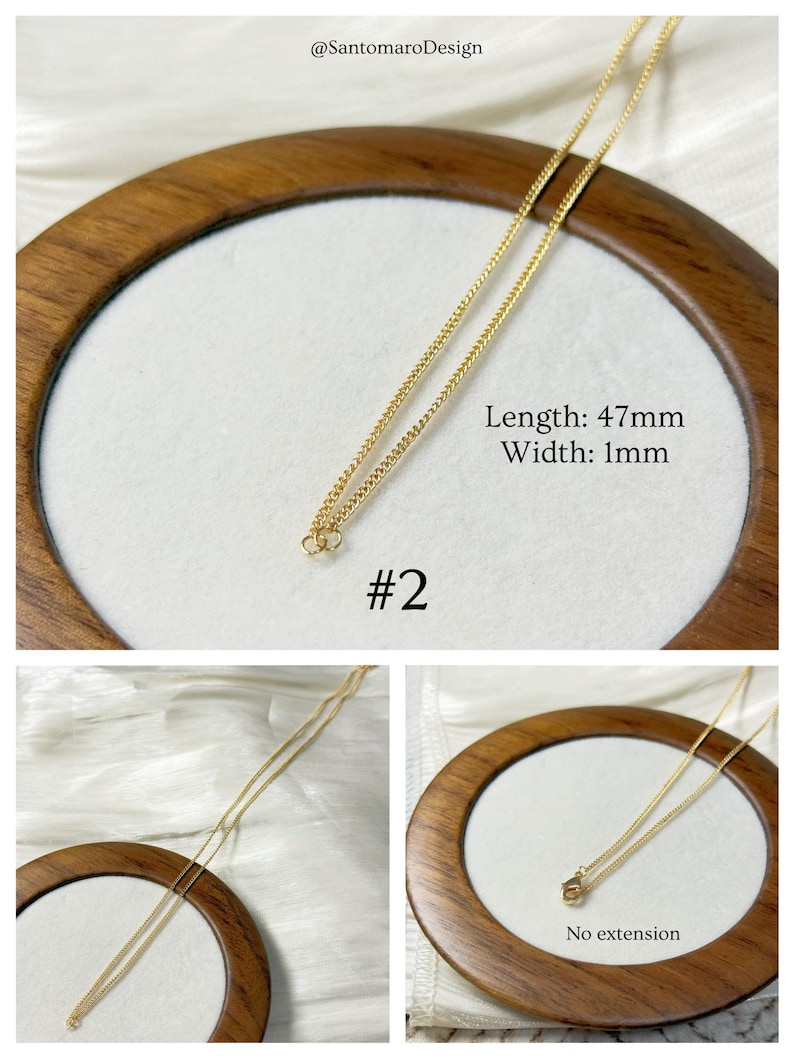 Op de afbeelding: Een delicate goudkleurige ketting. De ketting is 47 mm lang en 1 mm breed. De tekst "Lengte: 47 mm Breedte: 1 mm" en "#2" is inbegrepen. De ketting wordt gepresenteerd op een wit oppervlak in een houten frame.
