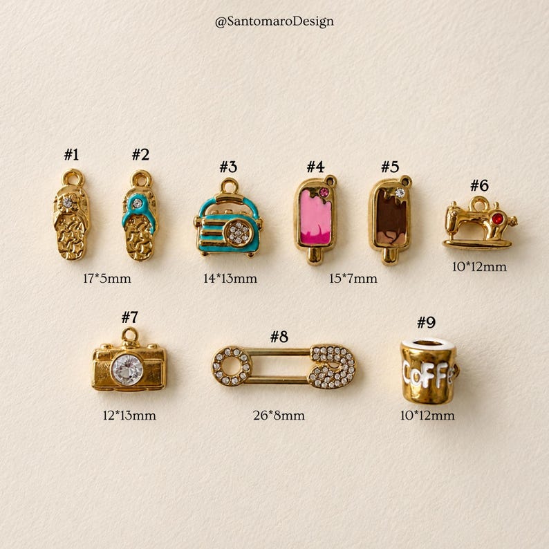 May include: A collection of gold-colored charms, including a flip-flop, a car, an ice cream bar, a sewing machine, a camera, a safety pin, and a coffee cup. The charms have various sizes, with the largest being 1.02 inches long.