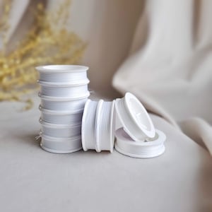 Beading Thread Tytan 100, high-quality white embroidery thread, is perfect for bead weaving, jewelry making. Strong thread 100m - 10bobbin