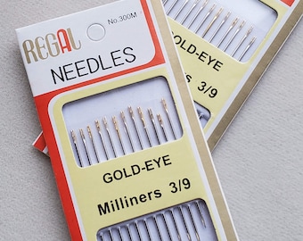 May include: A pack of Regal Gold-Eye Milliners needles, size 3/9, in a white and yellow pack with red trim. The pack has the text "Regal Needles" and "No. 300M" printed on it.
