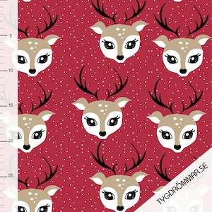 May include: Red fabric with a repeating pattern of white polka dots and brown deer faces with black antlers. The deer have large black eyes and white noses.