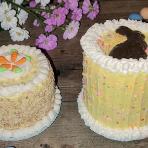 May include: A set of three ceramic mugs with a speckled, matte finish. The mugs are in shades of cream, light gray, and dark gray. Each mug has a simple, minimalist design, perfect for coffee or tea.