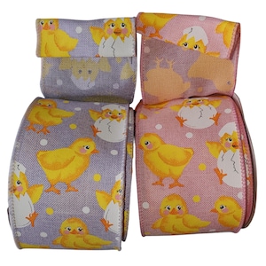 May include: Two rolls of wired ribbon featuring a repeating pattern of yellow chicks and white eggshells. One roll has a light purple background with white polka dots, while the other roll has a light pink background with white polka dots.