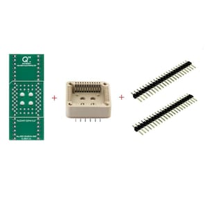 May include: An assortment of electronic components, including a green circuit board with text, a beige square socket, and two black and silver pin headers. The components are arranged against a white background.