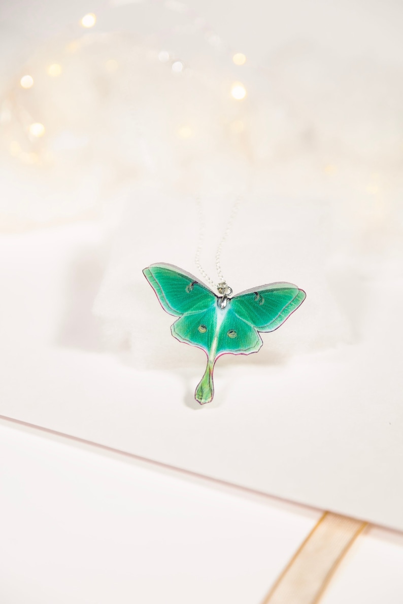 Handcrafted Green Lunar Moth Pendant on a delicate silver chain - Eco-friendly nature-inspired jewelry for fashion-conscious women