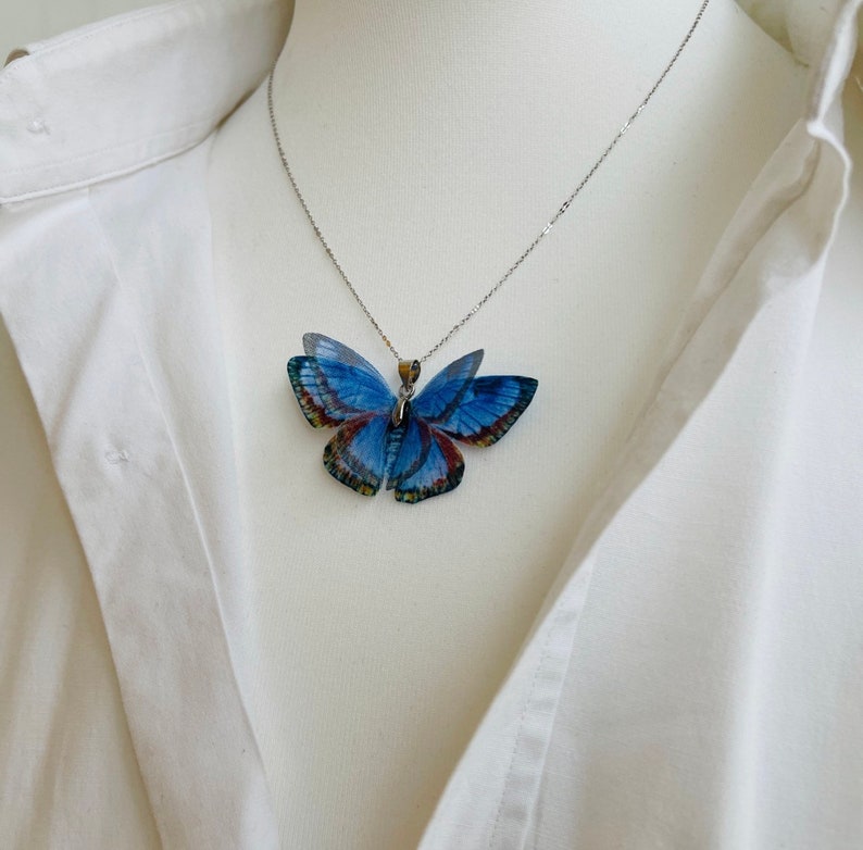 Blue butterfly pendant necklace with silver chain