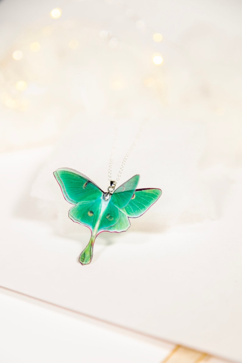 Green Lunar Moth Pendant with chain on a white background - Perfect for everyday wear or special occasions