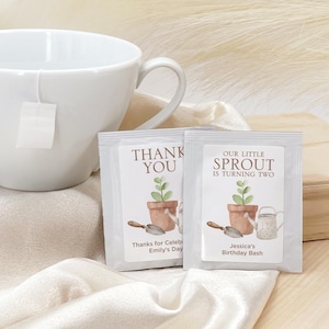 May include: Two small seed packets with watercolor illustrations of potted plants, trowels, and watering cans. One reads "Thank You" and "Thanks for Emily's Day." The other says "Our Little Sprout is Turning Two" and "Jessica's Birthday Bash."