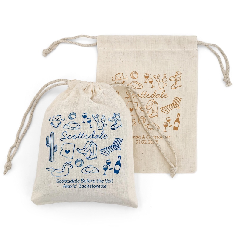Two drawstring bags (5" x 7") with blue and gold printed Scottsdale themed illustrations. The bags offer two lines of custom text and have a variety of Scottsdale illustrations including cowboy hat, cowboy boots, cactus, and pool floats.