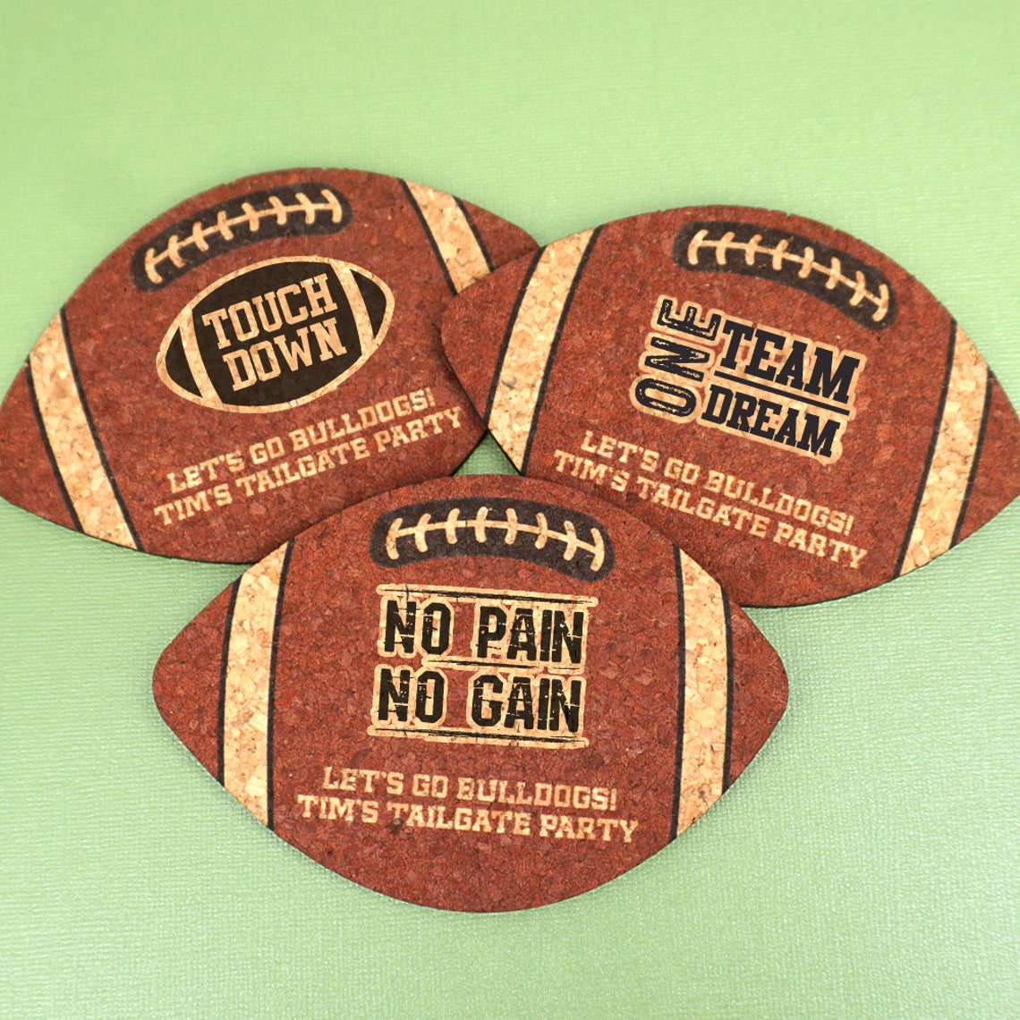 Three personalized football coasters.