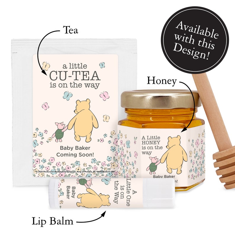 May include: A Winnie the Pooh themed baby shower gift set with a tea bag, honey jar, and lip balm. The packaging features a pink and blue floral design with the text "a little CU-TEA is on the way" and "Baby Baker Coming Soon!"