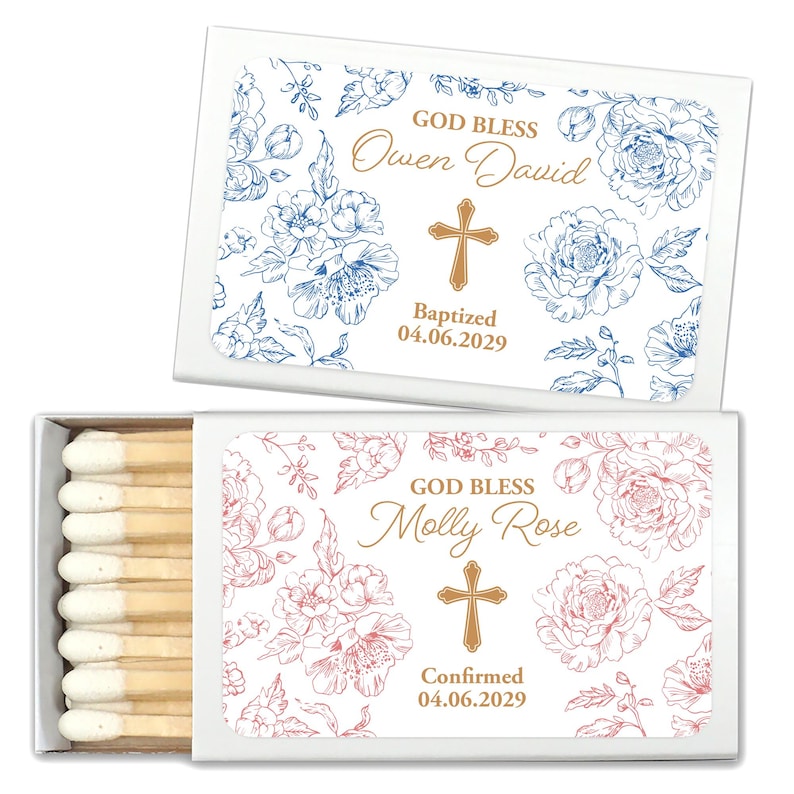 Puede incluir: Dos cajas de cerillas blancas con dise&ntilde;os florales y texto dorado. Una caja tiene detalles florales azules y dice "GOD BLESS Owen David Baptized 04.06.2029." La otra tiene detalles florales rosas y dice "GOD BLESS Molly Rose Confirmed 04.06.2029."