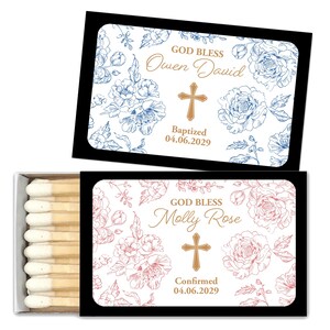 Puede incluir: Dos cajas de cerillas con dise&ntilde;os florales. Una caja presenta flores azules y el texto "God Bless Owen David Baptized 04.06.2029." La otra tiene flores rosas y dice "God Bless Molly Rose Confirmed 04.06.2029."