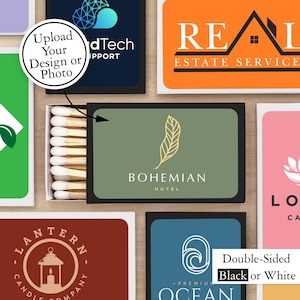 May include: A set of matchboxes with various designs. The matchboxes are black with white text and graphics. The designs include a hotel logo, a real estate logo, a candle company logo, and an ocean-themed logo. The matchboxes are double-sided, with black or white options.