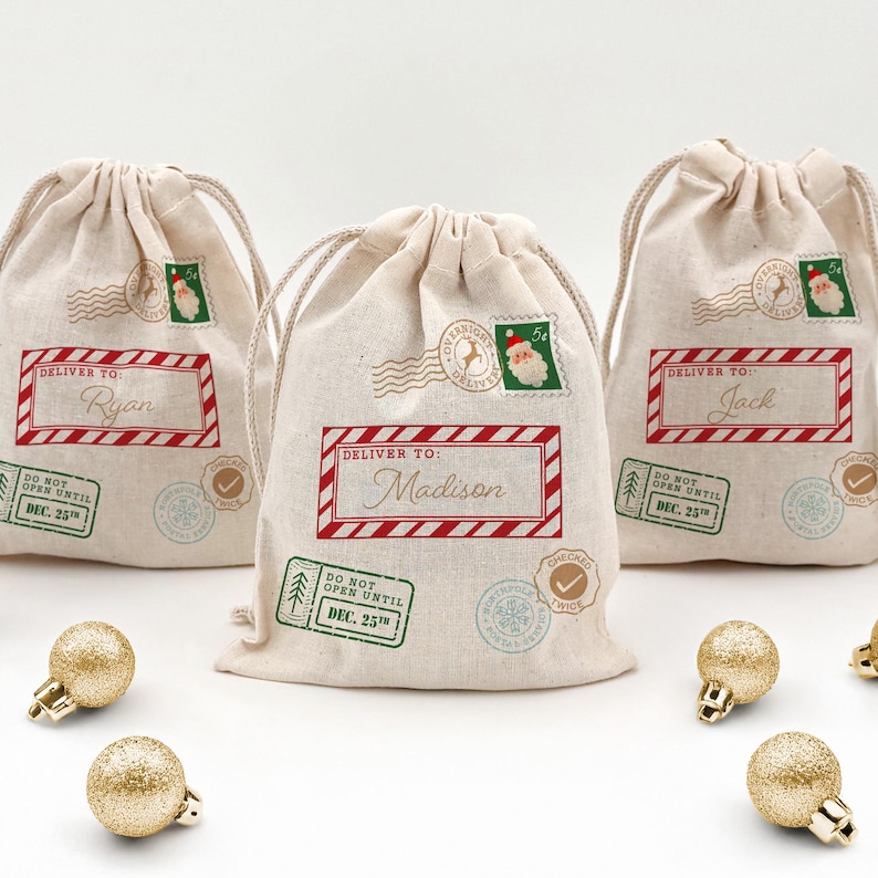 Three mini drawstring bags designed as a Santa sack with a Santa stamp, Do Not Open till Christmas stamp, and a checked twice stamp.  Personalized with a red stripe box and first name in gold.