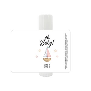 May include: Lip balm tube with a label featuring the text "oh Baby!" and a watercolor sailboat design in pink, blue, and brown. The label also includes the text "Line 1" and "Line 2".