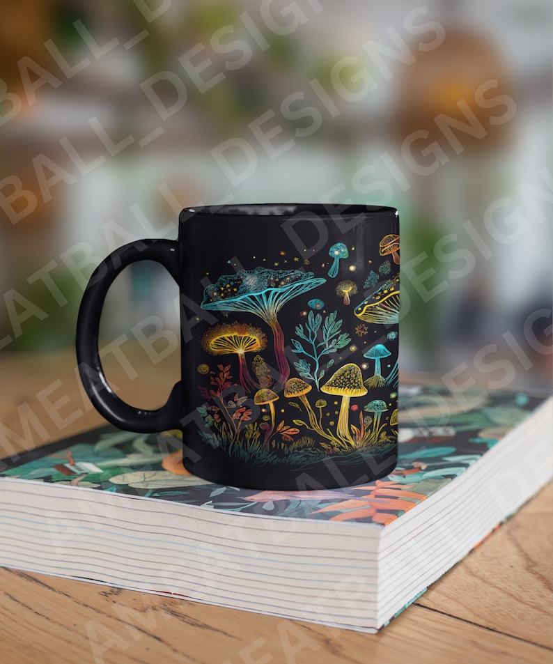 May include: Black ceramic mug with a colorful mushroom design. The mushrooms are drawn in a whimsical style with glowing details. The mug is sitting on a stack of books.