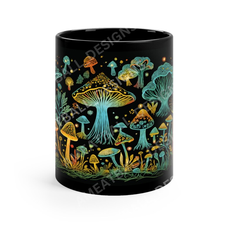 May include: Black ceramic mug with a colorful illustration of mushrooms and foliage. The mushrooms are in shades of yellow, orange, and blue, and the foliage is green. The background is black.