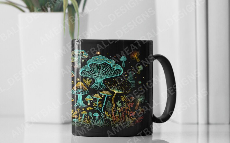 May include: Black ceramic mug with a colorful illustration of mushrooms and plants. The design features a variety of mushrooms in shades of blue, green, and yellow, with intricate details.
