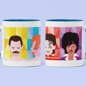 May include: Two white ceramic mugs with blue rims. Each mug features a different iconic musician: Freddie Mercury, David Bowie, Michael Jackson, and Prince. The mugs have a geometric pattern in bright colors.
