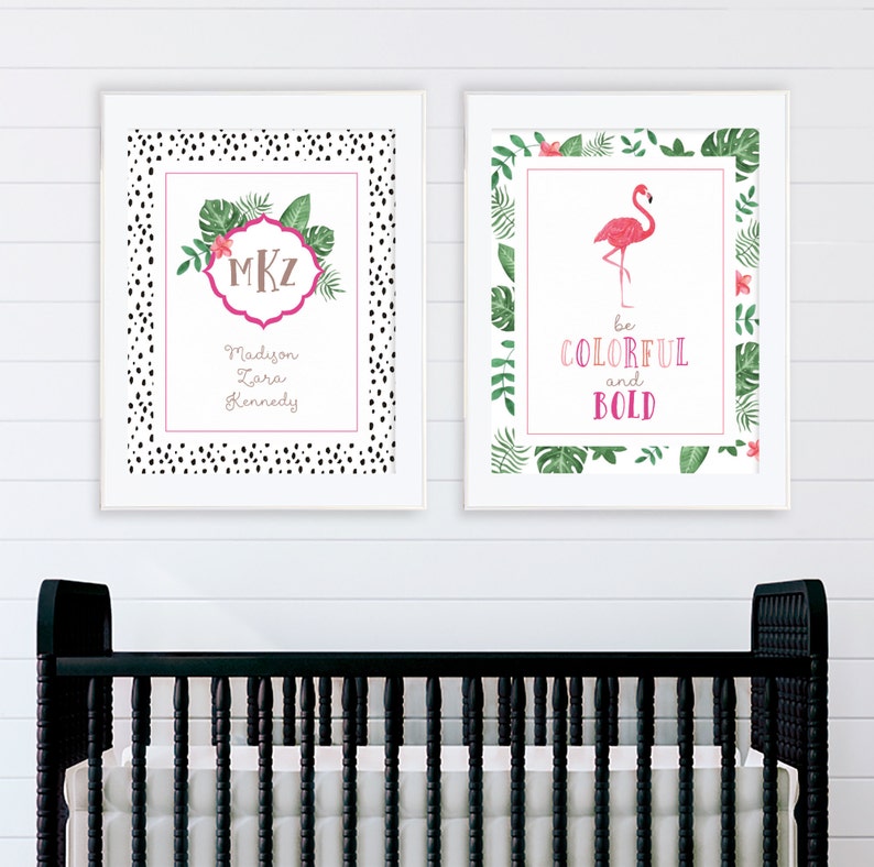 May include: Two framed prints with a tropical theme. The first print has a black and white polka dot border and features a monogram with the initials MKZ and the name Madison Zara Kennedy. The second print has a green tropical leaf border and features a pink flamingo with the text "be colorful and bold".