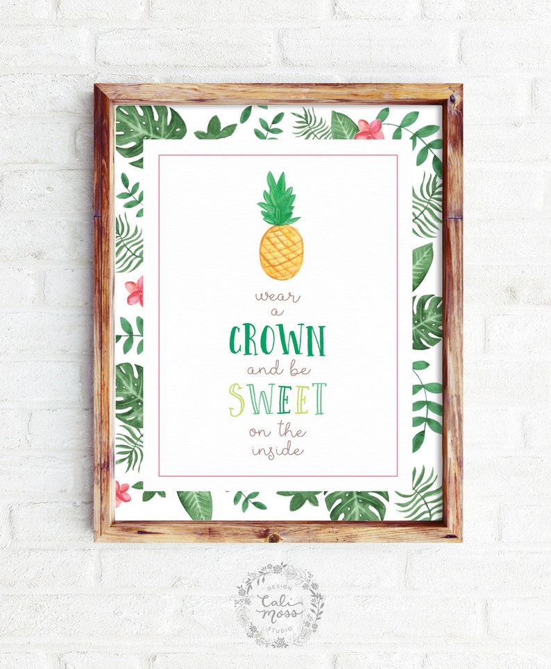 May include: A printable poster with a tropical theme featuring a pineapple and the text "wear a crown and be sweet on the inside". The poster has a green and white border with tropical leaves and flowers.