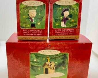 Set of Three Hallmark Keepsake ‘A Snoopy Christmas’ 50th Celebration Woodstock on Doghouse with Lucy and Linus Which Fit Together