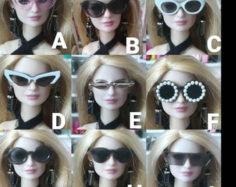All sunglasses fit 11,12 inch doll.
