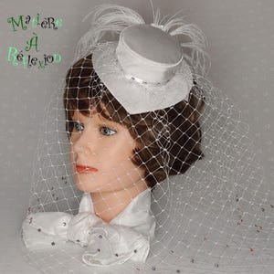 Small white heart-shaped bridal hat