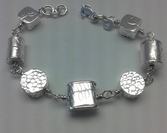 Sterling silver hand fabricated bead bracelet.
