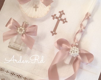 4 piece matching baptism set. Blush, crystal and pearl details. Set includes towel, candle, oil bottle and shell