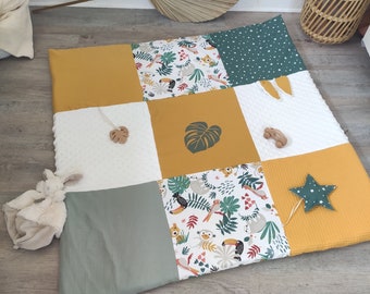 Removable jungle theme playmat with sage green and mustard yellow cover