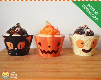 May include: Three Halloween-themed cupcakes in decorative wrappers. The wrappers feature a black cat, a jack-o'-lantern, and a mummy design. The cupcakes are topped with frosting and sprinkles. The image includes the text "Instant Download".