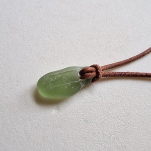 Genuine English seaham  Sea Glass pendant necklace, on real leather cord, in solid green. Naturally surf tumbled. Beach glass.
