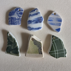 Piezas de cerámica japonesa de playa perforadas en la parte superior