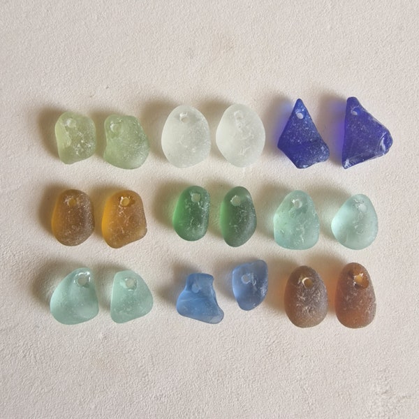 Genuine Seaham English sea glass pieces in various shades. Top drilled. Ideal pendants/crafts/earrings. Naturally surf tumbled. Paired