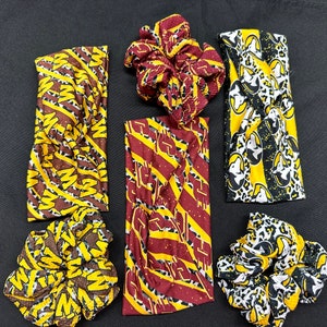 May include: Set of five hair accessories featuring a yellow, brown, and black patterned design. The accessories include two headbands and three scrunchies.