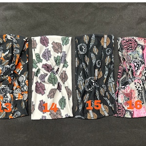 May include: Four different patterned headbands with a twist design. The headbands are black, white, black, and pink with various Harley Davidson logos and designs. The headbands are numbered 13, 14, 15, and 16.