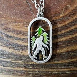 Bigfoot Necklace, Sasquatch Pendant with Chain, "Bigfoot in the Forest" with Green Trees, Sold by Each