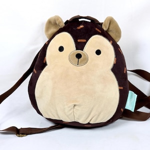 May include: A rustic wooden sign with the text "Welcome to our home" in white lettering. The sign features a distressed finish and a simple, inviting design, perfect for front door decor.