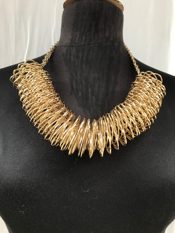 80's expandable coil modernist gold metal necklac… - image 1