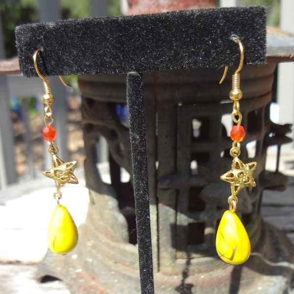 Earrings with Bright Lemon Lime Acrylic Teardrop with a Brass Star Connector and a Small Orange Glass Bead