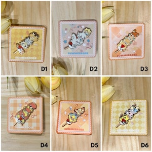 May include: Six square backing cards labeled SUMMERROSE, each displaying a metal enamel pin featuring a stack of three cartoon creatures balanced on a stick. The pins showcase various colorful character designs, including small animals and pokeballs.